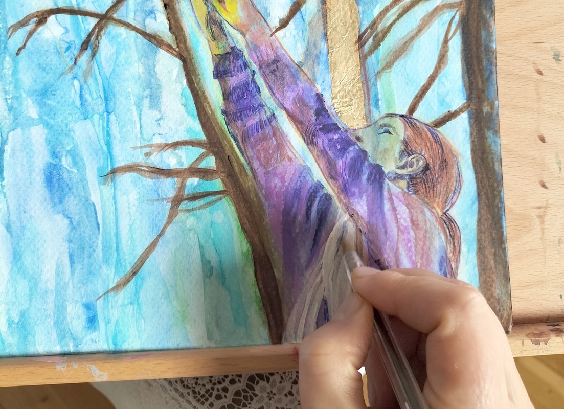 Photo of my mixed media painting in progress. Woman reaching for the sky with trees. She is wearing a purple cardigan.
